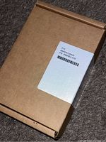 Brown cardboard box packaging for Barracuda disk drive with label showing part number 2TB8A8LU-570