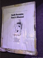 Photo of user's manual for Swift Portable ultrasonic scaler showing cover page with device image and contact information for DBI America.