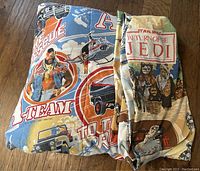 A-Team comforter with visible vibrant design and colors laid flat enough to appreciate the characters and scenes depicted.