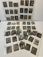 54 vintage advertising cards with suggestive poses preserved in sleeves.
