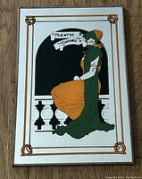 Full view of the vintage advertising mirror showing the entire illustration framed by a thin border.