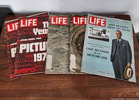 Five vintage LIFE magazines arranged in a row showing covers, includes 1972 Year in Pictures issues, and dated 1967 and 1969
