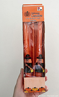 Original boxed packaging showing two orange witch candles for Halloween, with pumpkin themed box design and Kmart branding.