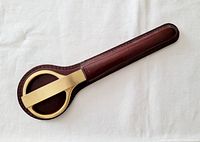 Top view of leather case with gold plated tops for scissors and letter opener.