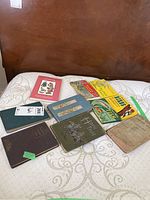 Photo showing nine vintage books arranged on a white bedspread, including titles such as Horse Tales and The Water Babies.