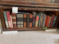 Full shelf view of all books included in the lot, showing spines and titles for identification.