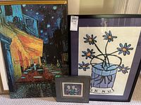Three art pieces grouped showing from left the large Van Gogh Cafe Terrace canvas, middle small 12x12 framed print with abstract figures, and right 32x23 floral print framed and matted artwork.
