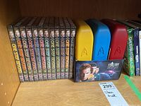 Twelve Star Trek One Step Beyond DVD volumes lined up showing full set in packaging with additional DVD cases and original series DVD