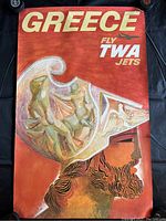 Front view of the vintage Greece travel poster showing the design and artwork including the Greek warrior and wine glass illustration, plus promotional text for TWA jets.