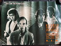 Black and white photo of R.E.M. band members with text 'YOU ARE THE EVERYTHING'