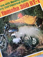 Close up of magazine cover featuring Yamaha 360 RT-T motorcycle with rider in yellow jacket.