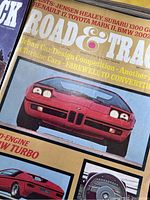 Close-up of magazine cover showing red BMW Turbo on the cover with distinctive Road & Track masthead.