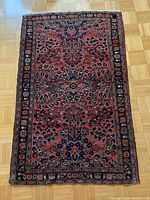 Full view of rug laid flat on wood floor