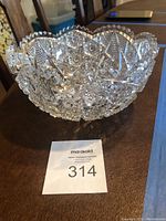 Side view of the deep cut American Brilliance glass fruit bowl highlighting the patterned cut and scalloped rim.