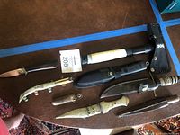 Overview of lot showing all cutting tools laid out on table