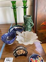 Overview of entire lot showing all items including candlesticks, ceramic bowls, glass bowl, ceramic vase, and decorative box