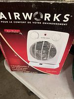 Photo showing Airworks Air Pulse space heater box with image and French text describing product features.