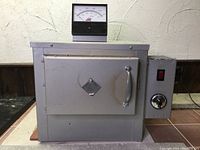 Front view of kiln showing door, handle, gauge and side controls