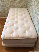 Overhead view of mattress and box spring assembled on frame