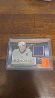 Photo of the Ed Jovanovski hockey jersey card featuring a blue fabric swatch and a photo of the player.