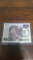 Photo of an Evgeni Malkin rookie hockey card with a Pittsburgh PA cancellation stamp, encased in a plastic protective sleeve