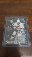 Photo of Wayne Gretzky hockey card in protective plastic case.