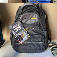 Front view of the black and gray AWP HP tool backpack with tags attached.
