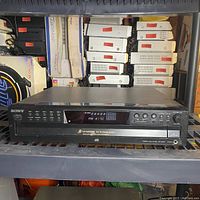 Front view of the Sony CDP-CE375 5-disc CD changer showing the display panel and control buttons.