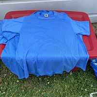 Front view of one blue vintage Russell Athletic shirt, showing overall color, cut and condition.