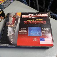 Box front showing product information, features, and usage images for ResQLadder emergency escape ladder 15 feet length for second floor exit.