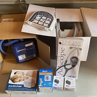 Overview of all items including Breg Polar Care Cube, LectroFan noise machine, ReliOn blood pressure monitor, Clinician Series stethoscope, and two Zacurate pulse oximeters.