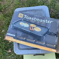Original boxed Toastmaster nonstick electric griddle with visible box wear, shrink wrapped.