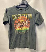 Front view of the dark gray short sleeve Led Zeppelin U.S. Tour 1975 T-shirt showing graphic and text.