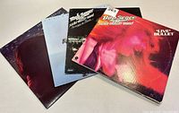 Four Bob Seger record albums arranged side by side showing the front covers with various artistic and live performance images.
