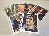 Six 8x10 signed personalized Star Wars celebrity promotional photos laid out in protective sleeves with various alien character portraits.