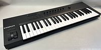Angled view of keyboard showing keys, wheels, knobs and overall condition