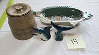 Full view of all four pottery items: lidded canister, fish-shaped bowl, swordfish head and tail salt and pepper shakers.