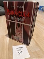 Front view of the boxed book set titled 'Bunnicula In A Box' showing a rabbit behind bars on the cover, credited to James Howe.