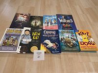 Overview of 9 early reader books laid out on floor with clear view of titles and colorful covers.