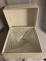 Clear square shaped crystal bowl inside original white box, showing internal geometric diagonal ridged lines design.