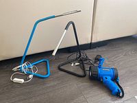 Lot showing two USB powered desk lamps and one blue rechargeable USB flashlight on floor.