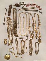 Full overview of assorted jewelry laid out on white background