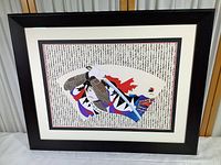 Framed Japanese samurai print artwork with a sword and calligraphy background.