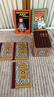 Overview of Raggedy Ann books and McGuffey Reader collection showing all books and decorative box
