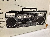 Box illustration showing front view of the Fisher PH-W405 portable stereo