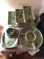 Overall view of the Pfaltzgraff snack tray serving set arranged on a surface, showing three rectangular snack trays, square dish with handle, and small pitcher.