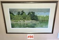 Full view of the framed Glen Loates art print showing the landscape scene with water and loons.