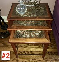 Three rosewood nesting tables stacked, showing overall configuration