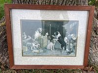 Front view of framed black and white courthouse dog print showing multiple dogs and cats in a setting resembling a courthouse or courtroom.