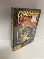Front view of the sealed Atari 2600 Commando game box with military themed artwork and original price stickers.